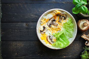 scramble fried eggs omelet with mushrooms Menu concept healthy eating. food background top view copy space for text keto or paleo organic product diet