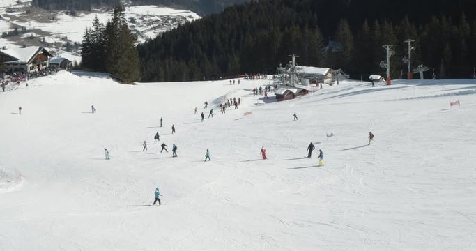 Tourists Skiing Along the Thick Snowy Mountains