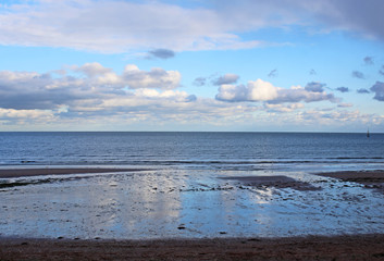 Clouds reflected on Paignton Beach, Devon