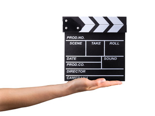 Human hand holding film clapper board isolated on white background