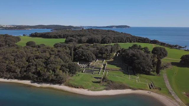 Flight over ruins of ancient Roman residential villa on desert Brijuni island, Croatia