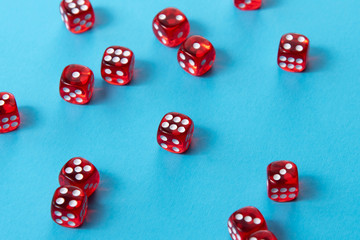 Bright red dice on blue background
