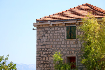 Traditional Mediterranean architecture and garden in small town Sutivan, on island Brac, Croatia.
