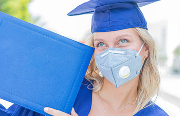female graduate in cap and gown