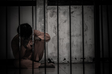 Portrait of man desperate to catch the iron prison,prisoner concept,thailand people,Hope to be...
