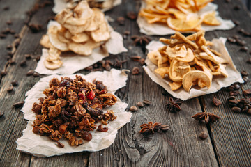 Fototapeta premium Dried slices of orange, apple, bananas and pear on paper