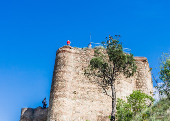 Tourist taking selfies at the fortress of Narikala the main sight locations in the city.  Tbilisi,...
