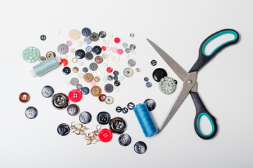 Scissors and buttons in different colors.
