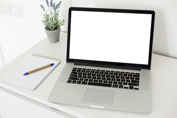 Fototapeta premium Laptop with blank screen on table