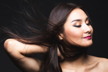 Obraz premium Portrait of young asian woman with makeup long hair.