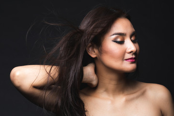 Portrait of young asian woman with makeup long hair.