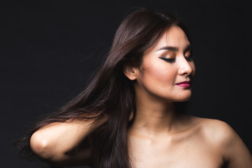 Fototapeta premium Portrait of young asian woman with makeup long hair.