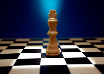 King standing in spotlight, his next move options highlighted.