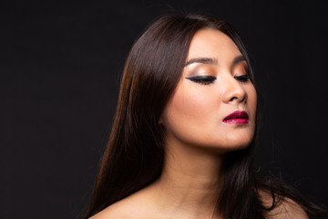 Portrait of young asian woman with makeup long hair.