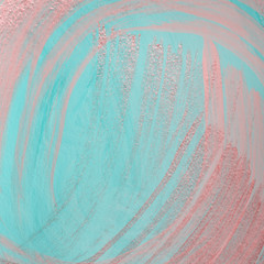 Pink metallic brush strokes on blue pastel background. Dry brush technique. Hand painted background or texture for your design