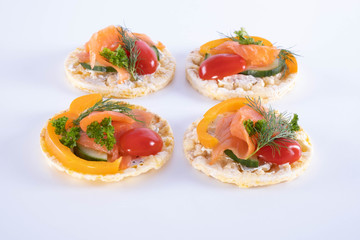 salmon, tomatoes, paprika and dill on corn waffles