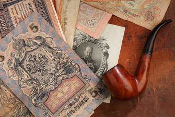 Russian money of the early twentieth century and a pipe for Smoking