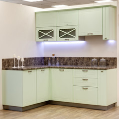 a kitchen interior with drawers