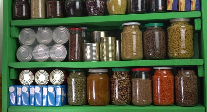 Buying Food In Bulk During The Coronavirus Lockdown Period. Home Pantry Shelves With Long-term Storage And Canned Products