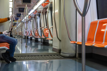 Rome, Italy - April 30, 2020: Inside the metro of line A the seats remain empty due to the...