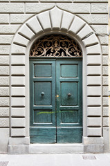 decorated and ancient door of historical building of the Italian Renaissance