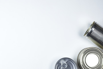 tin cans of different sizes on a white background. copyspace.