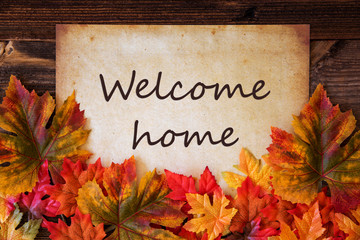 Grungy Old Paper With English Text Welcome Home. Colorful Autum Decoration With Leaves