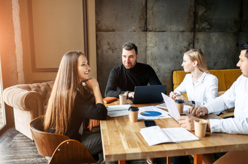 Young business team in a modern office in a relaxed atmosphere on a meeting