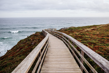 Fototapeta na wymiar photo of a wooden pier leading to the coast