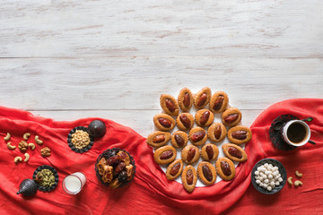 Ramadan food background. Eid Dates sweets on a white wood background