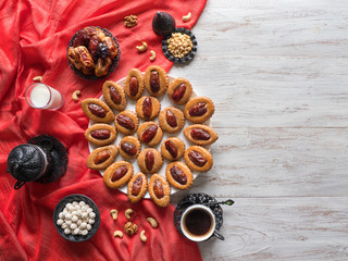Ramadan food background. Eid Dates sweets on a white wood background
