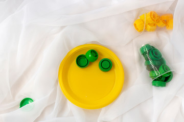 Save nature, stop using plastic. The concept of plastic waste.  Heap of plastic bottle caps on...