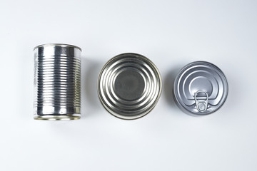 tin cans of different sizes on a white background
