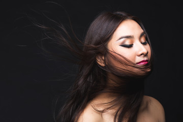 Portrait of young asian woman with makeup long hair.