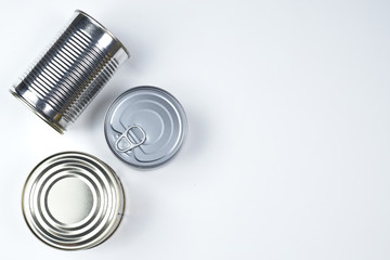 tin cans of different sizes on a white background. copyspace.
