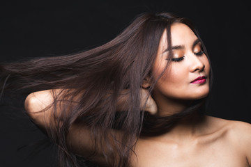 Portrait of young asian woman with makeup long hair.