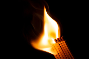 A row of matches being ignited