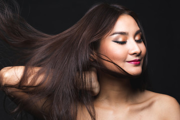 Portrait of young asian woman with makeup long hair.