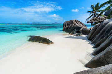 Anse Source d'Argent at La Digue Island, Seychelles. Heavenly beach with dazzling white sands, crystal clear waters, surrounded by beautiful granite boulders and coconut palms.