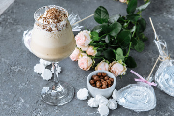cold fresh ice coffee with chocolate, garnished with biscuit and sweets