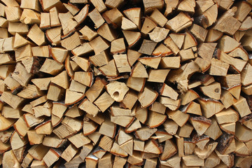 A heap of chopped firewood in woodpile