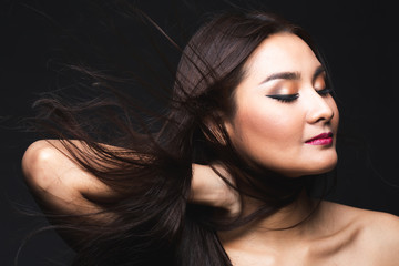 Portrait of young asian woman with makeup long hair.