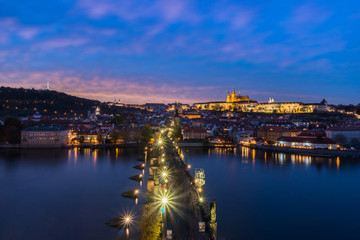 Czech Republic. Cityscape of Prague at sunset with view of Charles Bridge and Prague Castle.