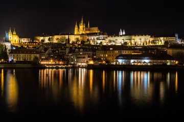 Czech Republic. Cityscape of Prague at night with view of Prague Castle.