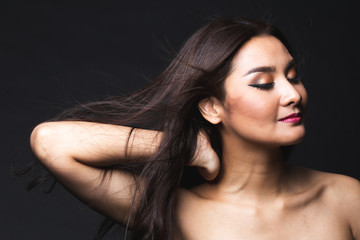 Fototapeta premium Portrait of young asian woman with makeup long hair.
