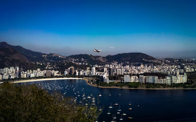 Fototapeta premium View of Rio de Janeiro with plane overflight, Sugarloaf cable car, Rio de Janeiro, Brazil