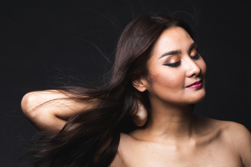 Portrait of young asian woman with makeup long hair.