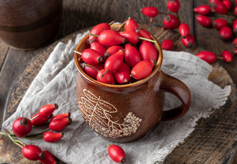 Fresh rose hips in a cup
