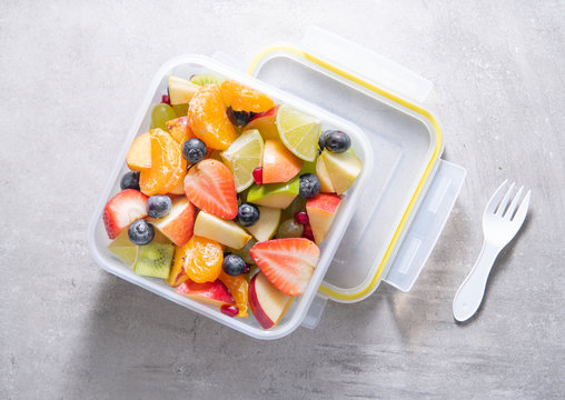 Packed Fruit Salad In Plastic Box. Healthy Meal To Go