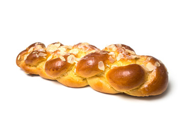 Closeup of braided almonds cake on white background